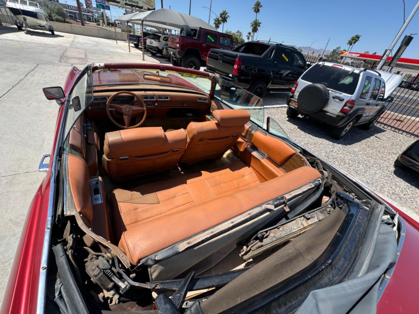 1975 Red Cadillac Eldorado convertible. , located at 2190 Hwy 95, Bullhead City, AZ, 86442, (928) 704-0060, 0.000000, 0.000000 - 1975 Cadillac Eldorado Convertible. Great project car for someone. New tires. Runs and drives, power top works. has a/c doesn't work. needs restoration. interior needs work, engine needs to be serviced . clear title. - Photo#5